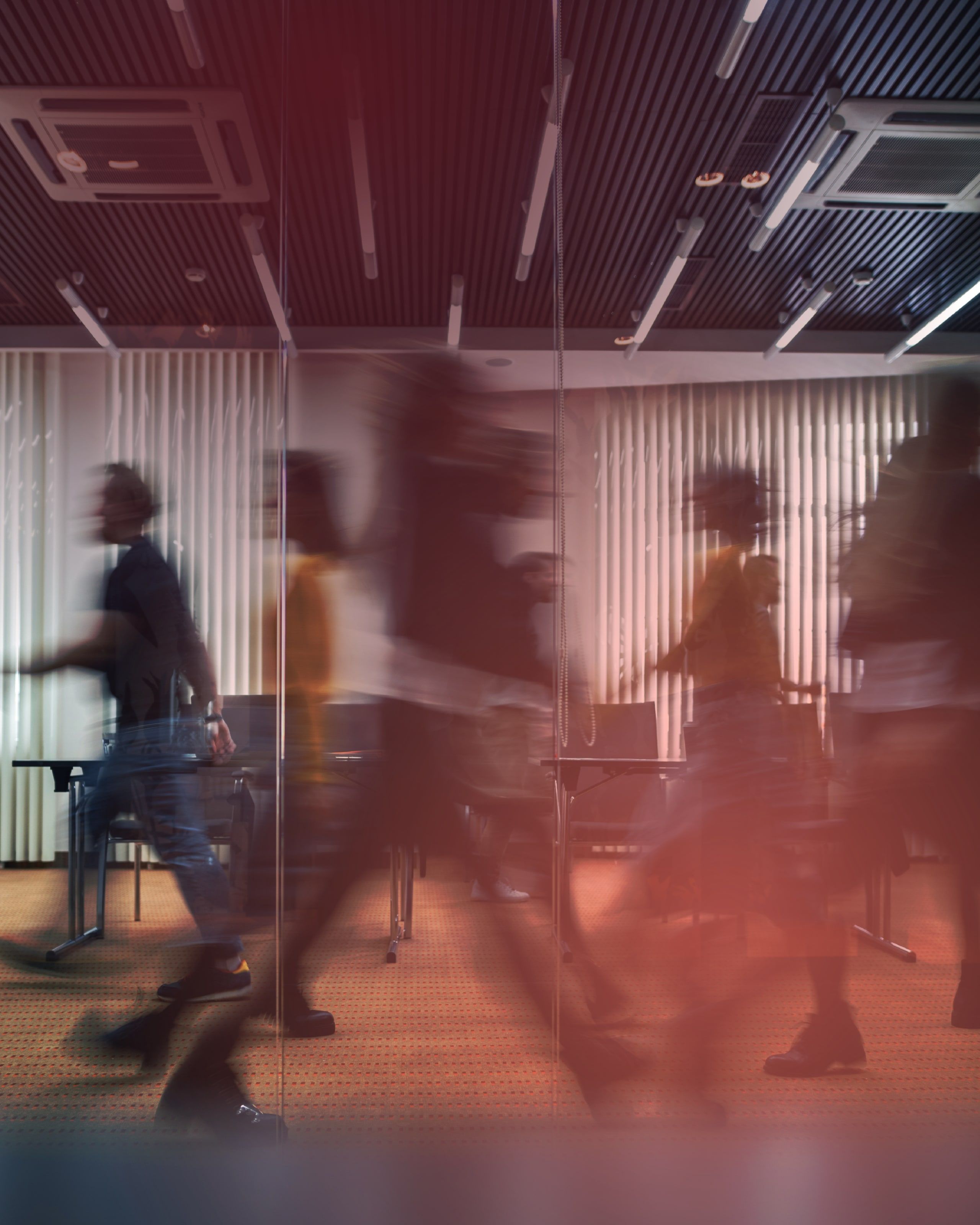 Open-plan office with people in motion
